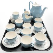 Twenty six pieces of Johnson Brothers floral decorated coffee china on blue ground.