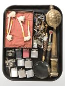 A group of pipes, lighters, magnifying glass, brass box in the form of a tortoise,