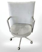A Danish Erik Jorgensen designed Partner chrome framed executive swivel armchair in pale blue suede