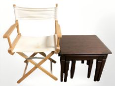 A nest of tables and a director's style chair