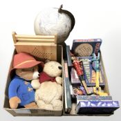 A group of toys and games, Winnie the Pooh and Paddington Bear toys, terrestrial globe, etc.