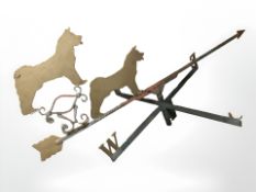 A painted cast iron weather vane surmounted by two dogs,