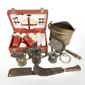 A Sirram picnic set, a group of blow lamps, Victorian brass coal scuttle, a scythe, etc.