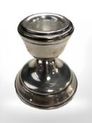 A loaded silver squat candlestick, Birmingham marks, height 6 cm.