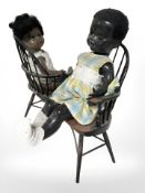 Two vintage jointed dolls, sat on a conversation seat, width 40 cm.