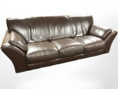 A contemporary brown leather three seater settee, 220 cm x 100 cm x 75 cm.
