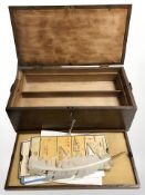 An oak two division storage box containing feather quill,
