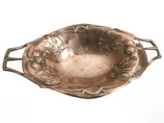 An Arts and Crafts copper twin handled bowl, width 39 cm.