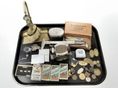 A tray of mixed collectables, Wills cigarette cards, large chromed paperweight in the form of a nut,