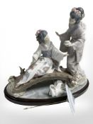 A Lladro figure group of two geisha on a bridge, height 32 cm.