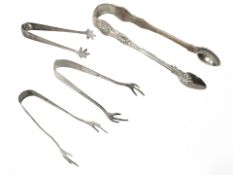 Four pairs of silver sugar tongs CONDITION REPORT: 102.
