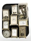 A group of mechanical and quartz carriage time pieces and various parts