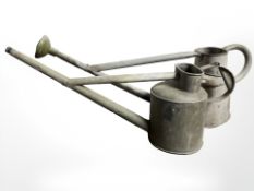 Two galvanised watering cans