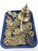 A group of horse brasses, companion set and a ships bell marked 'Titanic'.