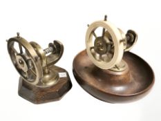Two nutcrackers in the form of ships wheels, largest 14 cm diameter.