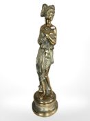 A cast brass statue of a scantily clad lady, height 67 cm.