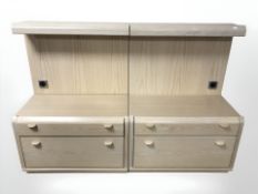A pair of oak effect bedside units,