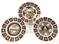 Three Royal Crown Derby porcelain limited edition Christmas plates, with certificates, diameter 21.