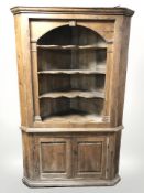 A 19th century pine corner cabinet, height 200 cm.