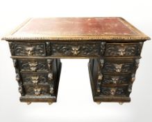A Victorian heavily carved oak twin pedestal writing desk,