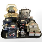 A group of novelty radios and a cassette player in the form of robots,