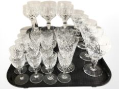 A group of drinking glasses including a pair of Edinburgh Crystal wine glasses