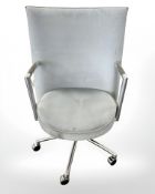 A Danish Erik Jorgensen designed Partner chrome framed executive swivel armchair in pale blue suede