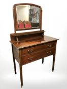 A late Victorian mahogany and satinwood inlaid mirror back two drawer dressing table,