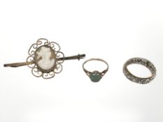A 9ct gold cameo brooch, similar hard stone ring, and a two-tone 9ct gold eternity ring.