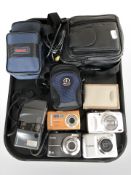 A group of digital cameras including Kodak, Fujifilm, Canon, etc.