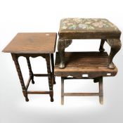 Two oak stools and a small lamp table.