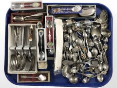 A quantity of collectors spoons and other cutlery.