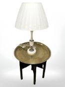 An Eastern bobbin turned folding occasional table with engraved brass top, diameter 57 cm,