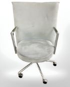 A Danish Erik Jorgensen designed Partner chrome framed executive swivel armchair in pale blue suede