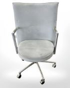 A Danish Erik Jorgensen designed Partner chrome framed executive swivel armchair in pale blue suede