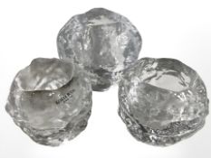 Three Kosta Boda glass snowball tea light holders, largest 7 cm high.