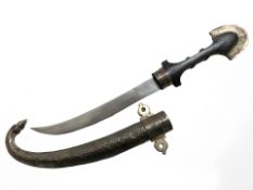 An Arabic jambiya knife, blade 22 cm, in metal sheath.