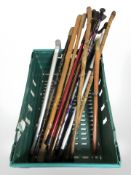 A quantity of vintage and modern walking sticks.