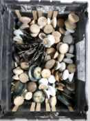 A quantity of wooden drawer knobs, cast metal bow handles, etc.