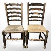 A pair of beech ladder back farmhouse chairs.