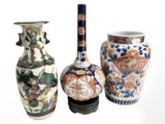 A Chinese earthenware famille verte baluster vase depicting warriors, height 25 cm,