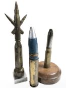 A trench art sculpture made from bullet casings, height 17.5 cm, and two further inert shells.