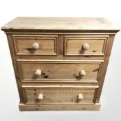 A contemporary pine four drawer chest, 97 cm x 49 cm x 102 cm.