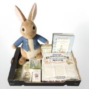 A group of Beatrix Potter collectables including stuffed toy, puzzles, plaster casting molds, etc.