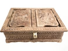 A reproduction Indian carved hardwood jewellery box, width 34 cm.