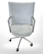 A Danish Erik Jorgensen designed Partner chrome framed executive swivel armchair in pale blue suede