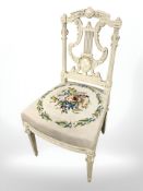 A painted French occasional chair in tapestry fabric.