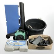 A large plastic bucket, petrol leaf blower, hydraulic rolling jack,