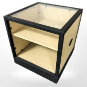 A contemporary glass topped display stand,