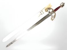 A fantasy sword in leather sheath, length 97 cm.
